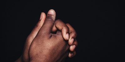 person holding babys hand